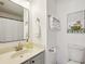 Bright bathroom featuring a gray vanity, decorative mirror, and tiger artwork at 5100 Burchette Rd # 3403, Tampa, FL 33647