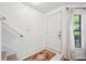 Bright entryway featuring white tile flooring, staircase and a charming welcome mat at 5100 Burchette Rd # 3403, Tampa, FL 33647