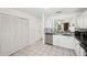 Kitchen featuring stainless steel appliances, white cabinets and tiled flooring at 5100 Burchette Rd # 3403, Tampa, FL 33647