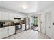 Bright kitchen with stainless steel appliances and sliding glass doors to the outside at 5100 Burchette Rd # 3403, Tampa, FL 33647