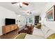 Spacious living room featuring a comfortable sofa, TV, and elegant decor at 5100 Burchette Rd # 3403, Tampa, FL 33647