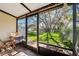 Enclosed patio with outdoor seating and scenic backyard view at 5100 Burchette Rd # 3403, Tampa, FL 33647