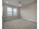 Neutral bedroom with carpet, recessed lighting, and two windows with blinds at 5351 Bridge St # 99, Tampa, FL 33611