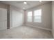 Neutral bedroom with carpet, recessed lighting, and a closet with sliding doors at 5351 Bridge St # 99, Tampa, FL 33611