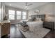 Comfortable bedroom with large windows, a ceiling fan, and stylish decor at 5351 Bridge St # 99, Tampa, FL 33611