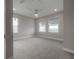 Spacious bedroom with neutral carpet, three windows with blinds, and recessed lighting at 5351 Bridge St # 99, Tampa, FL 33611