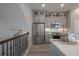 Kitchen showcasing gray cabinets, stainless steel appliances, and an island with white countertops at 5351 Bridge St # 99, Tampa, FL 33611