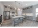Modern kitchen with a large island, stainless steel appliances, and elegant lighting fixtures at 5351 Bridge St # 99, Tampa, FL 33611