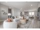 Open-concept living room connected to the kitchen and dining area with neutral tones and modern decor at 5351 Bridge St # 99, Tampa, FL 33611