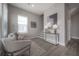 Cozy sitting area with wood-look tile, neutral decor, and easy access to the staircase at 5351 Bridge St # 99, Tampa, FL 33611