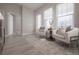 Cozy sitting area featuring wood-look tile flooring, neutral tones, and comfortable seating at 5351 Bridge St # 99, Tampa, FL 33611