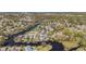 Aerial shot of waterfront homes, docks, and lush green landscape nestled along winding waterways at 5560 Frances Ave, New Port Richey, FL 34653
