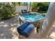 Enjoy a relaxing soak in this luxurious backyard hot tub surrounded by lush greenery and palm trees at 609 Osceola Rd, Belleair, FL 33756