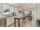 Bright kitchen featuring stainless steel appliances, granite countertops, and breakfast bar at 609 Osceola Rd, Belleair, FL 33756