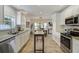 Bright kitchen with stainless steel appliances, granite countertops, and ample storage space at 609 Osceola Rd, Belleair, FL 33756