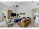 Bright living room with a comfortable leather sofa, modern decor, and plenty of space for relaxing at 609 Osceola Rd, Belleair, FL 33756