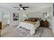 Calm main bedroom with neutral tones, plush bedding, and stylish wood nightstands at 609 Osceola Rd, Belleair, FL 33756