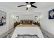 Neutral main bedroom featuring plush bedding, stylish nightstands and soft, natural light at 609 Osceola Rd, Belleair, FL 33756