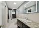 Bathroom featuring a granite vanity, bathtub, and modern finishes at 6109 Schooner Way, Tampa, FL 33615