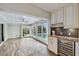 Florida room with built-in wine fridge, flows into living area, access to outdoor pool at 6109 Schooner Way, Tampa, FL 33615