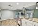 Kitchen with granite counters, stainless steel dishwasher, and views of the pool area at 6109 Schooner Way, Tampa, FL 33615