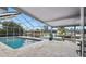 Enjoy this screened pool with waterway views, perfect for relaxing or entertaining guests at 6109 Schooner Way, Tampa, FL 33615