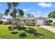 Charming single Gathering home with a well-manicured lawn and a beautiful palm tree at 6950 12Th N Ave, St Petersburg, FL 33710