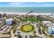 Panoramic aerial view of beachfront street featuring a charming pier at 706 Bayway Blvd # 301, Clearwater Beach, FL 33767