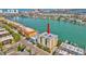 A condominium building with beautiful waterfront views, docks and palm trees at 706 Bayway Blvd # 301, Clearwater Beach, FL 33767