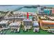 Aerial shot of waterfront condo with private docks and a community pool at 706 Bayway Blvd # 301, Clearwater Beach, FL 33767