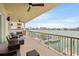 Spacious balcony with seating and stunning waterfront views at 706 Bayway Blvd # 301, Clearwater Beach, FL 33767