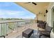 Spacious balcony with beautiful marina view, seating and ceiling fans at 706 Bayway Blvd # 301, Clearwater Beach, FL 33767
