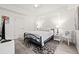 Cozy bedroom with queen bed, stylish rug, and ample natural light at 706 Bayway Blvd # 301, Clearwater Beach, FL 33767
