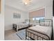 Bright bedroom with two twin beds and large windows overlooking the neighborhood at 706 Bayway Blvd # 301, Clearwater Beach, FL 33767