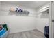 A simple walk-in closet with wire shelving offering ample storage space at 706 Bayway Blvd # 301, Clearwater Beach, FL 33767