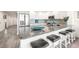Open kitchen features granite countertops, stainless appliances, seating, and tile flooring throughout the living space at 706 Bayway Blvd # 301, Clearwater Beach, FL 33767