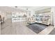 Open-concept living space that combines the living room and kitchen with tiled floors at 706 Bayway Blvd # 301, Clearwater Beach, FL 33767