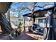 Outdoor patio featuring a gazebo, stylish seating, wood deck, and a tranquil backyard setting at 725 Philippe Pkwy, Safety Harbor, FL 34695