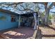 Outdoor patio featuring a gazebo, stylish seating, wood deck, and a tranquil backyard setting at 725 Philippe Pkwy, Safety Harbor, FL 34695