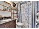 Bathroom with dark wood vanity and marble shower curtain at 725 Philippe Pkwy, Safety Harbor, FL 34695