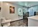 Bright, modern bathroom features a glass countertop sink and black marble tiled shower at 725 Philippe Pkwy, Safety Harbor, FL 34695