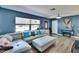 Comfortable living room featuring stylish furnishings, a cozy fireplace, and plenty of natural light at 725 Philippe Pkwy, Safety Harbor, FL 34695