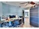 Home office with blue walls, wood floors, and built in shelving at 725 Philippe Pkwy, Safety Harbor, FL 34695