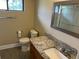 Bathroom with granite countertops and a walk-in shower at 730 S Village N Dr # 101, St Petersburg, FL 33716