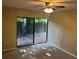 Bright bedroom with sliding glass door leading to private patio, offering seamless indoor-outdoor living at 730 S Village N Dr # 101, St Petersburg, FL 33716