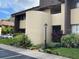 Condominium exterior features manicured landscaping and a well-maintained facade at 730 S Village N Dr # 101, St Petersburg, FL 33716