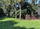 A condo building surrounded by lush trees and a manicured green lawn at 730 S Village N Dr # 101, St Petersburg, FL 33716