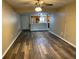 Inviting living room featuring wood floors, a ceiling fan, and an open layout, perfect for entertaining at 730 S Village N Dr # 101, St Petersburg, FL 33716