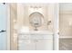 This bathroom features a vanity, stylish mirror, and tiled glass shower at 7301 S Swoope St, Tampa, FL 33616