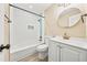 This bathroom boasts a bathtub shower, vanity, and modern fixtures at 7301 S Swoope St, Tampa, FL 33616